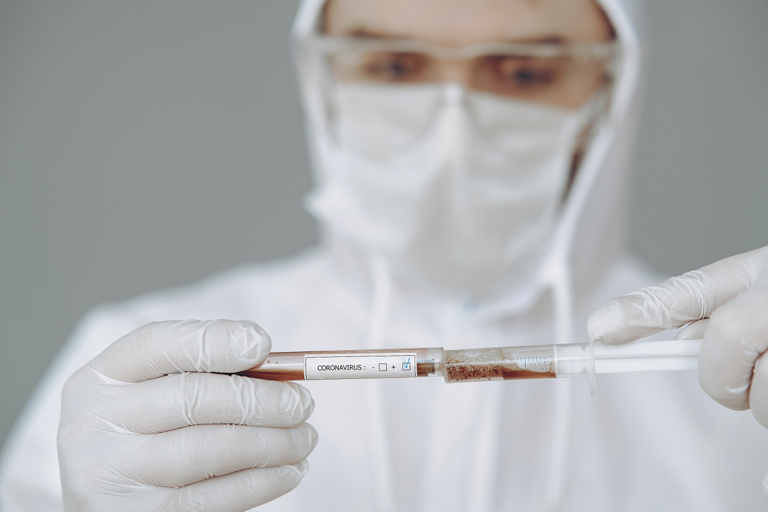 person-holding-test-tube-and-syringe-4149033 – resized