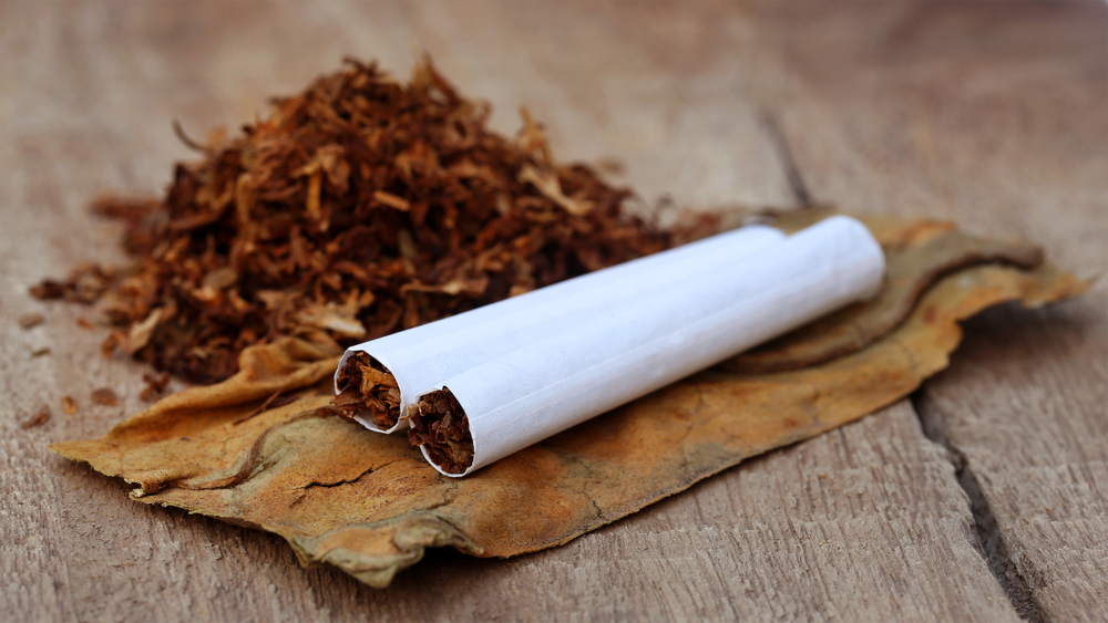 Tobacco,And,Cigarette,On,Wooden,Surface