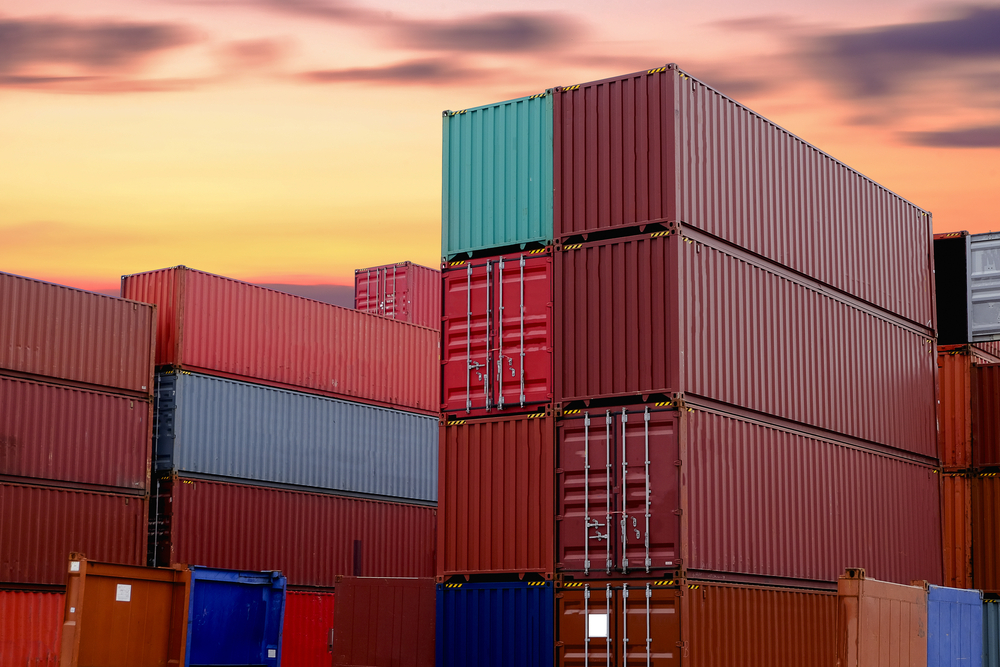 Container,At,The,Port,For,Import,And,Export,Business.,Sunset