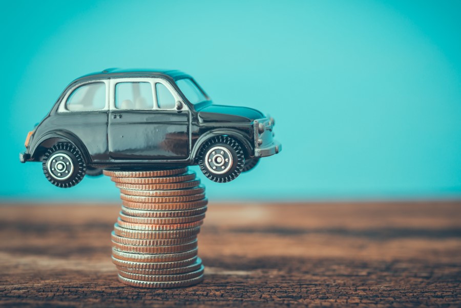 Miniature,Black,Second,Hand,Car,Model,On,Coins,Stack,On