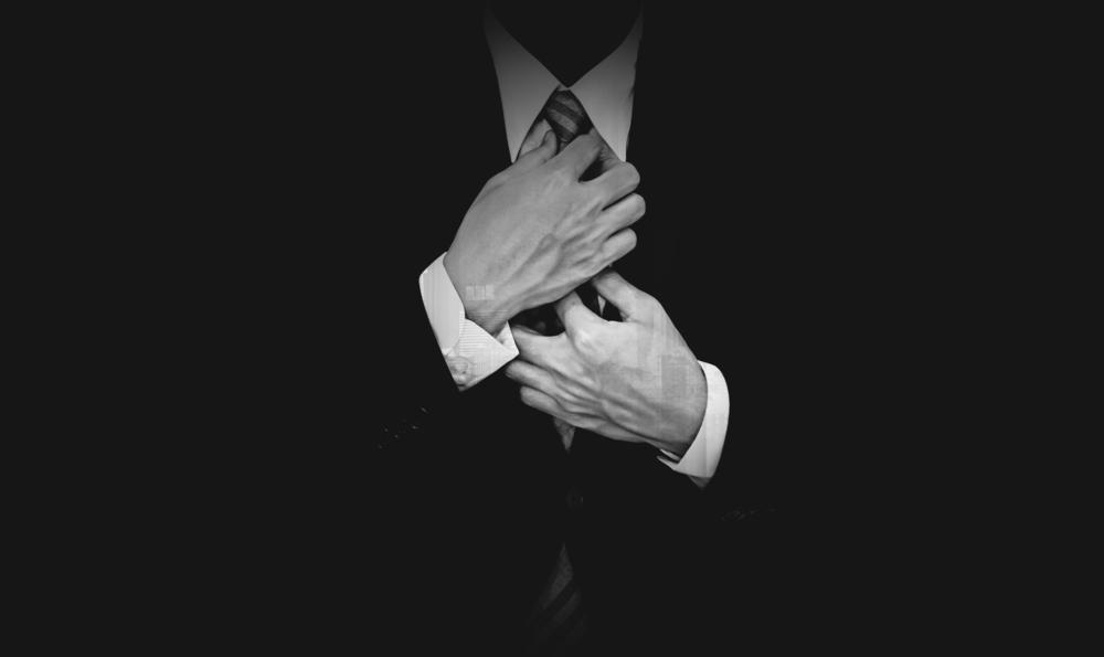 Businessman,In,Black,Suit,On,Black,Background,,Black,And,White